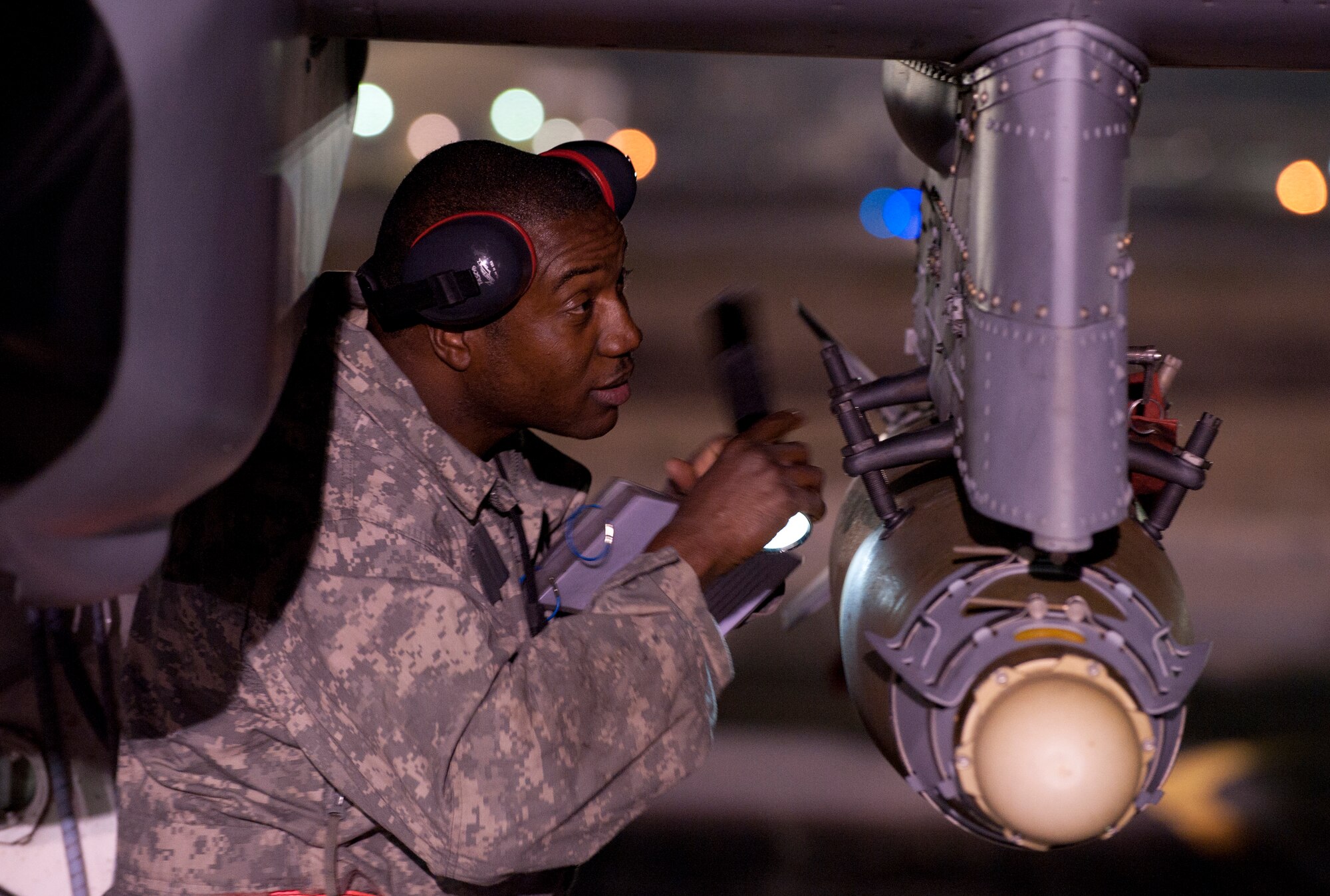 A weapons loader assigned to the 455th Expeditionary Aircraft Maintenance Squadron performs a pre- mission operations inspection on an A-10 Thunderbolt II at Bagram Airfield, Afghanistan, Oct. 17, 2012. The A-10 is part of a squadron of “Warthogs” that recently arrived from Davis-Monthan Air Force Base, Az., to fly missions in support of American and coalition forces here in Afghanistan. (U.S. Air Force photo/SSgt Jeff Nevison)