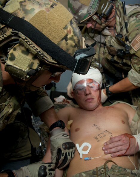 U.S. Air Force Staff Sgt. Eric Mathieson, 38th Rescue Squadron pararescueman, performs simulated medical procedures at Moody Air Force Base, Ga., Oct. 5, 2012. One of the procedures was to use an intravenous system on the patient. (U.S. Air Force photo by Senior Airman Douglas Ellis/Released)
