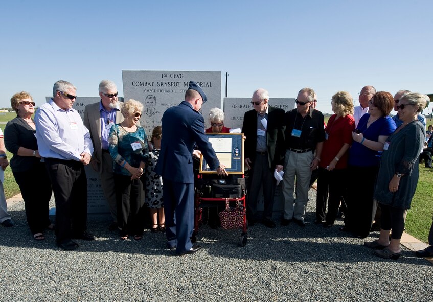 Maj. Gen. Stephen Wilson, 8th Air Force commander, presents the Silver Star for gallantry in action to the family of Master Sgt. James Calfee, killed in action March 11, 1968, during the Combat Skyspot Memorial rededication ceremony on Barksdale Air Force Base, La., Oct. 15. Calfee's decoration was upgraded from a Bronze Star, and members of his family were present to accept the decoration. (U.S. Air Force photo/Staff Sgt. Chad Warren)(RELEASED)