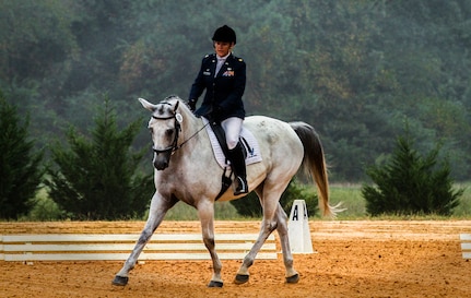 Maj. Laurie Lanpher, 628th Comptroller Squadron commander, competes with her nine-year-old Trakehner horse, Anniko, during the dressage portion of a three-day eventing competition. A Trakehner horse is a strong, explosive, light breed revered for its ability to excel in eventing competitions. Lanpher often refers to Anniko as her, “U.S. Air Horse.”  (Courtesy Photo)