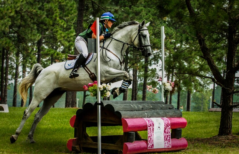 Maj. Laurie Lanpher, 628th Comptroller Squadron commander, competes with her nine-year-old Trakehner horse, Anniko, during the fence jumping portion of a three-day eventing competition. A Trakehner horse is a strong, explosive, light breed revered for its ability to excel in eventing competitions. Lanpher often refers to Anniko as her, “U.S. Air Horse.” (Courtesy Photo)