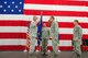 Col. Jeffrey Wiegand (second from right), 115th Fighter Wing Commander, salutes Brig. Gen. John McCoy (left), Wisconsin Air National Guard commander, after assuming command of the 115th Fighter Wing from Brig. Gen. Joseph Brandemuehl (right) on Oct. 14, at Truax Field, Madison, Wis. Also pictured is Chief Master Sgt. David Zoromski (second from left), Command Chief Master Sergeant of the 115th Fighter Wing. The passing of the flag is a symbolic gesture signifying change in leadership, ensuring the unit is always under command. (U.S. Air Force photo by Tech. Sgt. Ashley Bell)