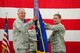Brig. Gen. Joseph Brademuehl (right), Wing Commander of the 115th Fighter Wing, passes the Air Force flag to Brig. Gen. John McCoy, Wisconsin Air National Guard commander. The passing of the flag is a symbolic gesture signifying change in leadership, ensuring the unit is always under command. (U.S. Air Force photo by Tech. Sgt. Ashley Bell)