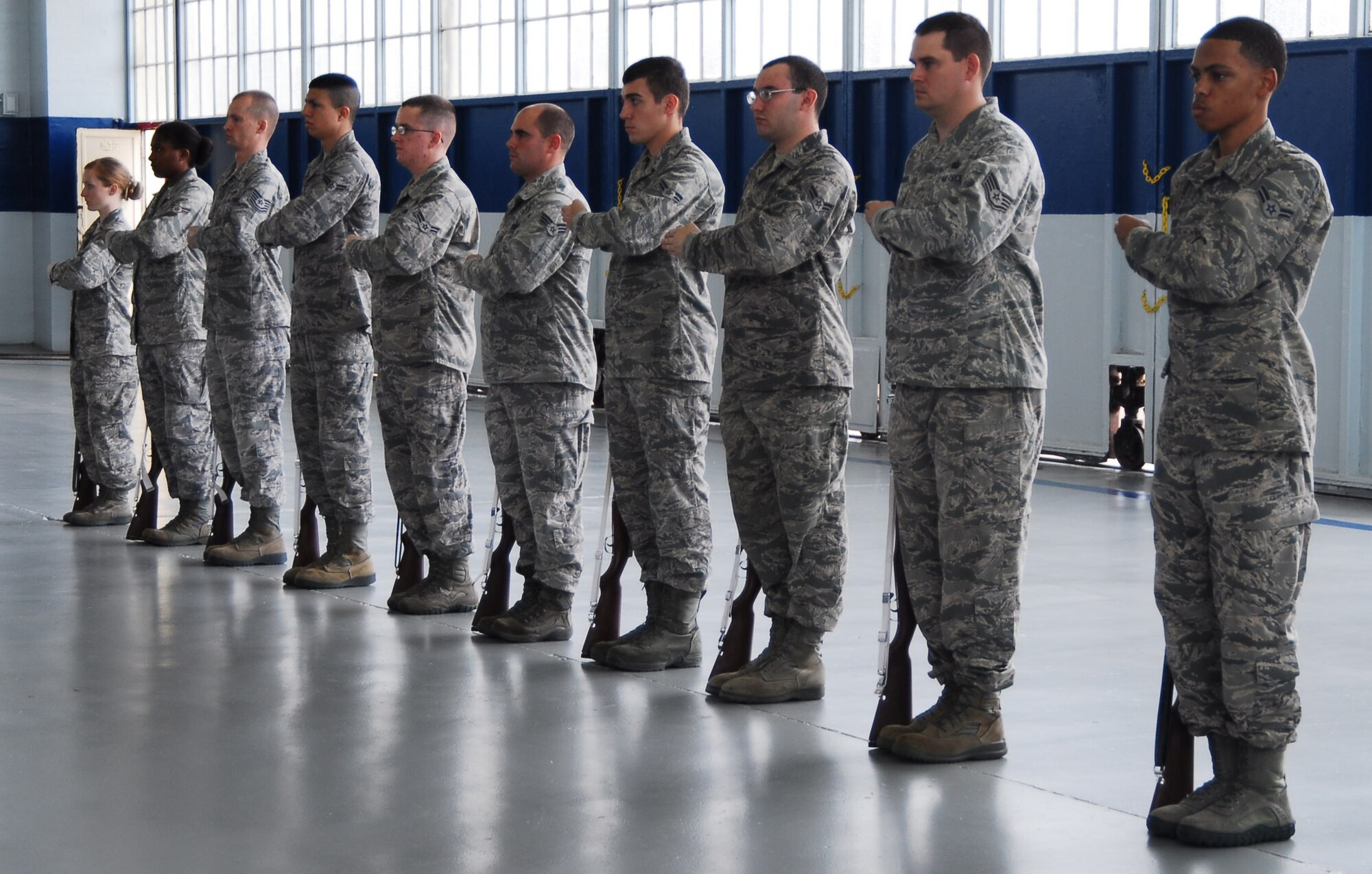 Members of the Maxwell Honor Guard practice ceremonial procedures while being observed by members of the Air Force Honor Guard team. Members of the Air Force Honor Guard from Joint Base Anacostia-Bolling, D.C. regularly travel to provide specialized training to base level honor guard members. (U.S. Air Force photo by Master Sgt. Michael Voss)    