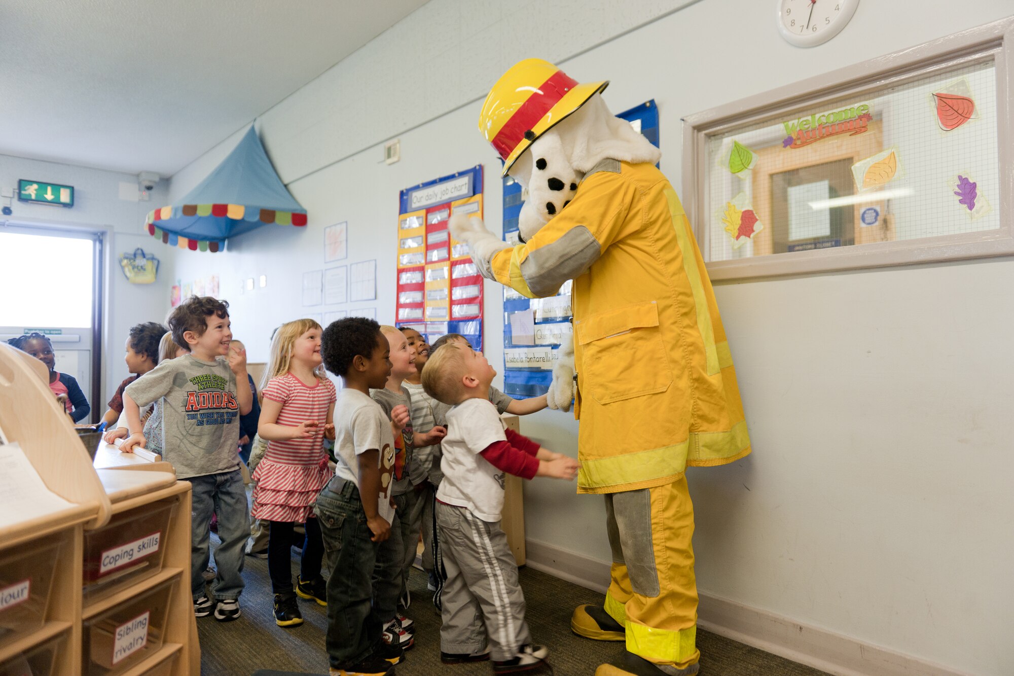 RAF ALCONBURY, United Kingdom – The 423rd Civil Engineer Squadron fire protection flight and Sparky visited the RAF Alconbury Child Development Center Oct. 11 as part of Fire Prevention Week at RAF Alconbury. This year’s theme, “Have 2 Ways Out!,” focuses on the importance of fire escape planning and practice. (U.S. Air Force photo By Staff Sgt. Brian Stives) 