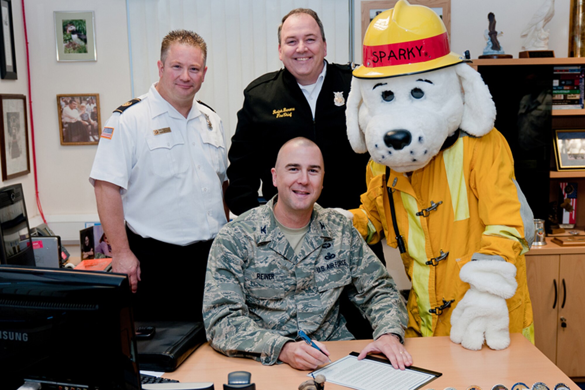 RAF ALCONBURY, United Kingdom – Col. Michael Reiner, 423rd Air Base Group commander, signs a proclamation deeming Oct. 9 – 12 Fire Prevention Week at RAF Alconbury Oct. 9. This year’s theme, “Have 2 Ways Out!,” focuses on the importance of fire escape planning and practice. (U.S. Air Force photo By Staff Sgt. Brian Stives)