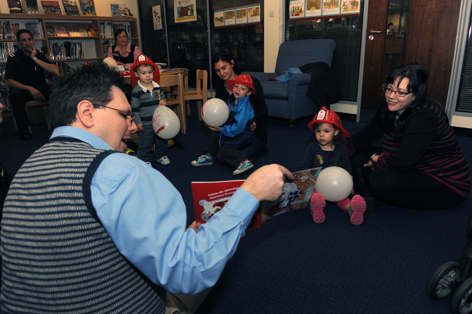 RAF CROUGHTON, United Kingdom – Children participate in “Story Time” at the RAF Croughton Library Oct. 9. This year’s Fire Prevention Week theme, “Have 2 Ways Out!,” focuses on the importance of fire escape planning and practice. (U.S. Air Force photo By Master Sgt. John Barton)
