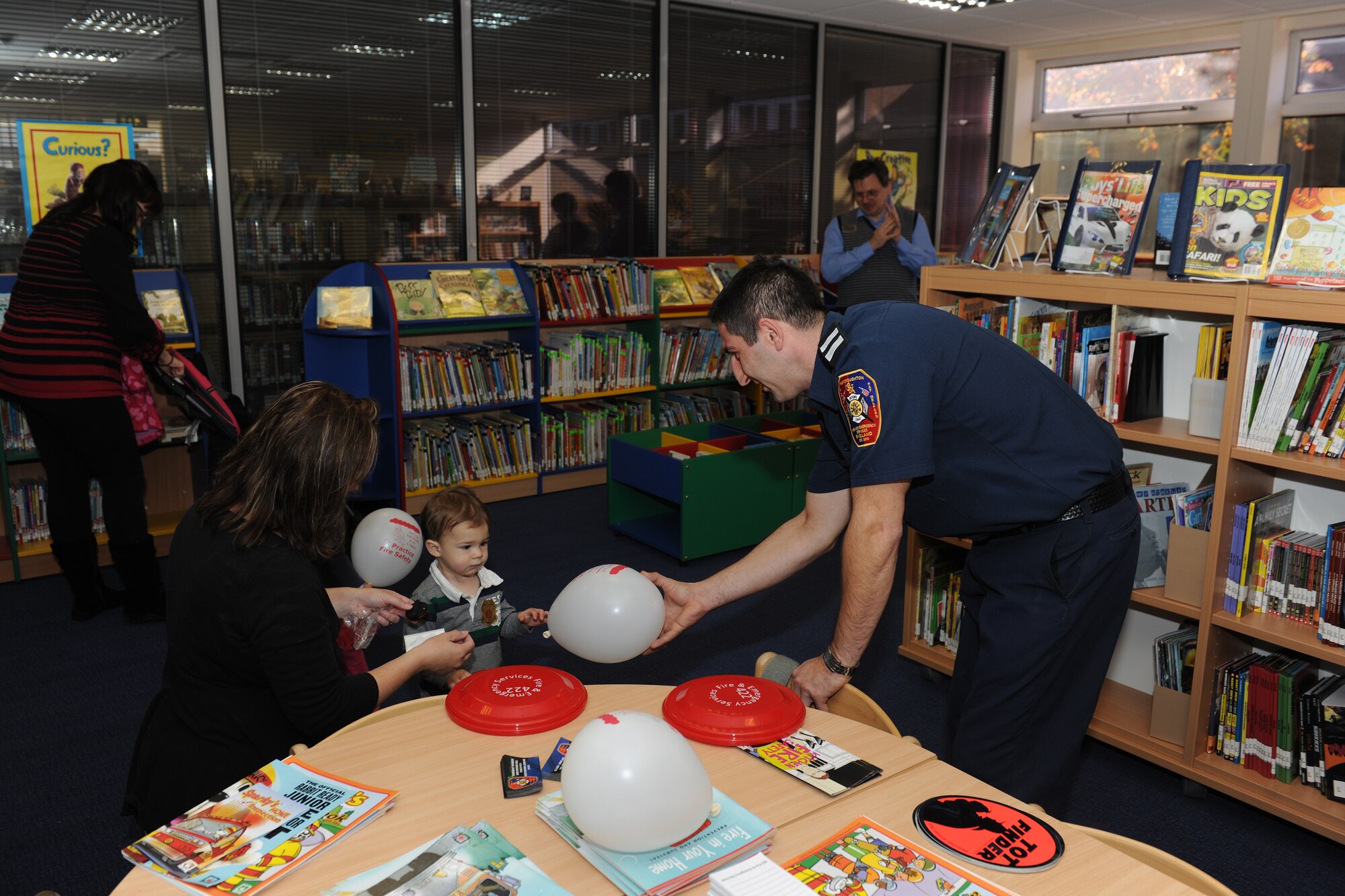 RAF CROUGHTON, United Kingdom – Children participate in “Story Time” at the RAF Croughton Library Oct. 9. This year’s Fire Prevention Week theme, “Have 2 Ways Out!,” focuses on the importance of fire escape planning and practice. (U.S. Air Force photo By Master Sgt. John Barton)