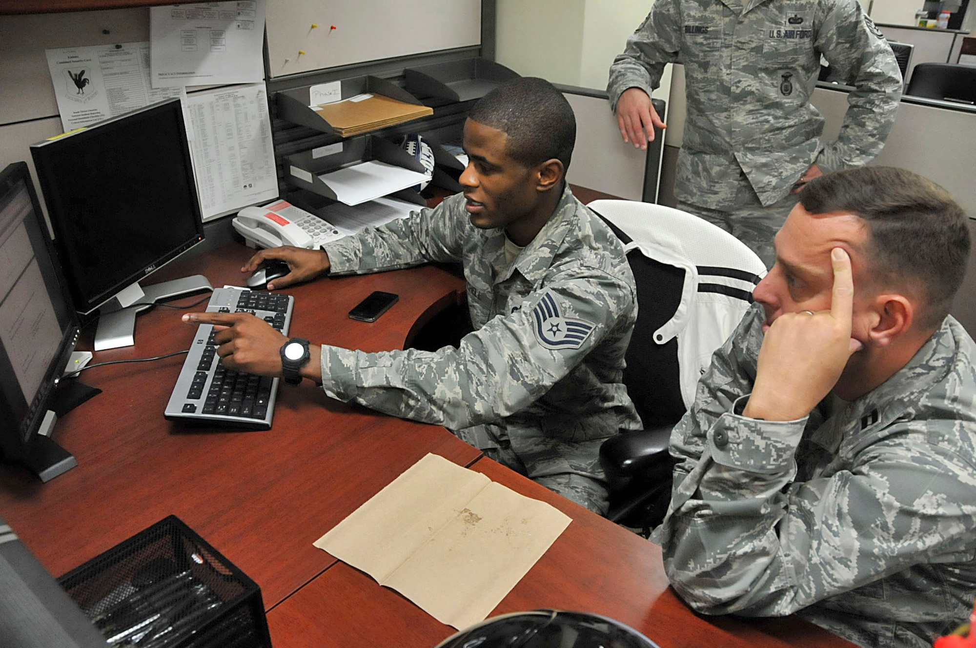 U.S. Air Force Staff Sgt. Sylvester Mitchell, 18th Security Forces Squadron response force member, explains a training tracking system to an inspector during the consolidated unit inspection at Kadena Air Base, Japan, Oct. 16, 2012. The inspector general teams assess areas mandated by law as well as mission areas that are critical or important to the health and performance of the organizations. (U.S. Air Force photo/Staff Sgt. Darnell T. Cannady)