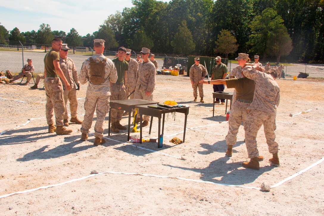 Marines from the military police detachment of Combat Logistics Battalion (CLB) 26, currently reinforcing the 26th Marine Expeditionary Unit (MEU), search and screen role-players during a non-combatant evacuation operation at Fort Pickett, Va., Sept. 20, 2012. CLB-26 is one of the three reinforcements of 26th MEU, which is slated to deploy in 2013.