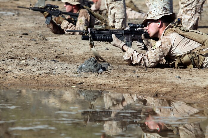 (DJIBOUTI, Oct. 2, 2012) - Marines with Bravo Company, Battalion Landing Team 1st Battalion, 2nd Marine Regiment, 24th Marine Expeditionary Unit, fire their M-4 carbines during a battle sight zero shooting range while training in Djibouti, Oct. 1, 2012. The training was part of a three-week exercise comprising basic infantry skills and desert survival techniques. The 24th MEU is deployed with the Iwo Jima Amphibious Ready Group as a theater reserve and crisis response force in U.S. Central Command and the Navy's 5th Fleet area of responsibility. (Photo by Staff Sgt. Robert L. Fisher III)