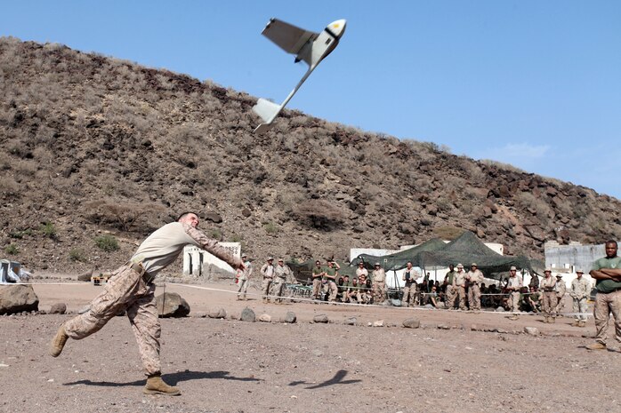 (DJIBOUTI, Oct. 7, 2012) - Lance Cpl. Richard A. Hager, 22, an intelligence specialist with Bravo Company, Battalion Landing Team 1st Battalion, 2nd Marine Regiment, 24th Marine Expeditionary Unit, and Easton, Penn., native, launches an RQ-11B unmanned aerial vehicle during a demonstration while training in Djibouti, Oct. 7, 2012. The capabilities of a UAV was one of the classes during a three-week training package, which paired Marines of Bravo Company with Marines of Combat Logistics Battalion 24, 24th MEU, to gain a shared understanding of each other's roles in the Marine Corps Air Ground Task Force. The 24th MEU is deployed with the Iwo Jima Amphibious Ready Group as a theater reserve and crisis response force throughout the U.S. Central Command in the Navy's 5th Fleet area of responsibility. (Photo by Staff Sgt. Robert L. Fisher III)