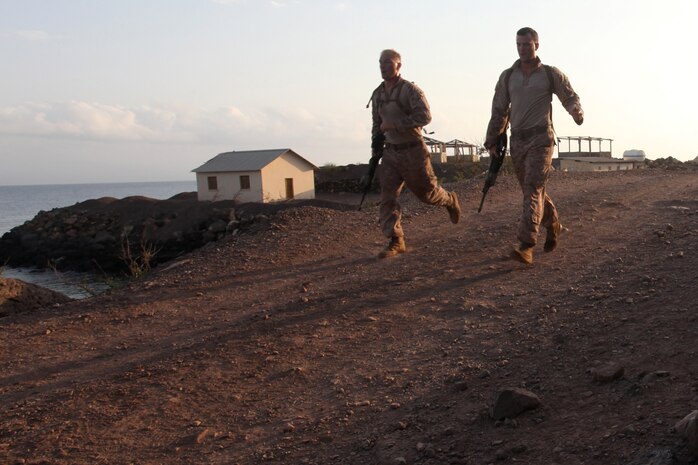 DJIBOUTI (Oct. 9, 2012) - Marines with Bravo Company, Battalion Landing Team 1st Battalion, 2nd Marine Regiment, 24th Marine Expeditionary Unit, run with their rifles during an endurance course while training in Djibouti, Oct. 9, 2012. The endurance course was part of a three-week training force package, which paired Marines of Bravo Company with Marines of Combat Logistics Battalion 24, 24th MEU, to gain a shared understanding of each other's roles in the Marine Corps Air Ground Task Force and refine their basic infantry skills in Djibouti's rugged terrain. The package comprised basic infantry skills, desert survival techniques, endurance courses and a simulated war. The 24th MEU is deployed with the Iwo Jima Amphibious Ready Group as a theater reserve and crisis response force in the U.S. Central Command and U.S. Navy's 5th Fleet area of responsibility. (Photo by Staff Sgt. Robert L. Fisher III)