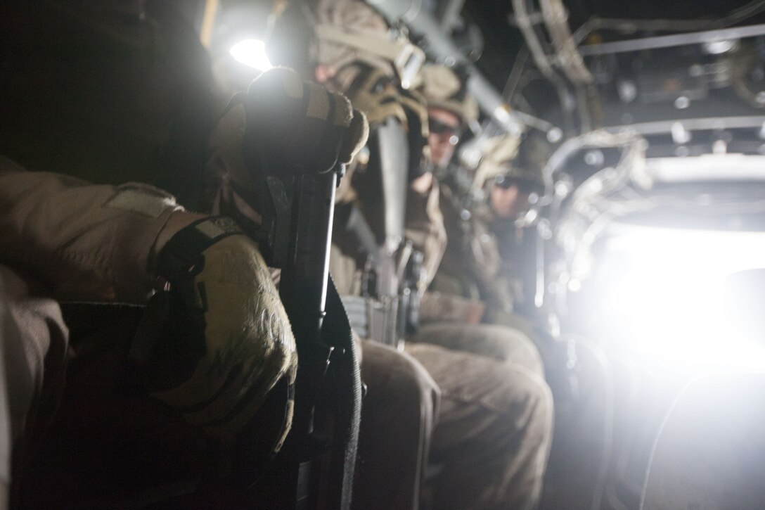Marines with India Company, Battalion Landing Team (BLT) 3/2, 26th Marine Expeditionary Unit (MEU), sit on an MV-22B Osprey during transit to a landing zone to conduct a mock raid at Marine Corps Base Camp Lejeune, N.C., Oct. 2, 2012. The company conducted a two-week vertical assault raid package with the Special Operation Training Group in order to help fulfill requirements from the 26th MEU’s mission essential task list. The 26th MEU is slated to deploy in 2013.