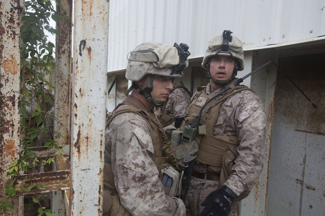 Marines with India Company, Battalion Landing Team (BLT) 3/2, 26th Marine Expeditionary Unit (MEU), await further orders while holding a secure area during a simulated raid at Marine Corps Base Camp Lejeune, N.C., Oct. 2, 2012. The company conducted a two-week vertical assault raid package with the Special Operation Training Group in order to help fulfill requirements from the 26th MEU’s mission essential task list. The 26th MEU is slated to deploy in 2013.