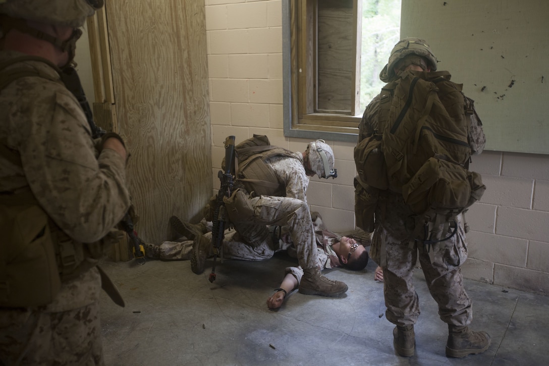 Marines with India Company, Battalion Landing Team (BLT) 3/2, 26th Marine Expeditionary Unit (MEU), check simulated enemy casualties at Marine Corps Base Camp Lejeune, N.C., Oct. 2, 2012. The company conducted a two-week vertical assault raid package with the Special Operation Training Group in order to help fulfill requirements from the 26th MEU’s mission essential task list. The 26th MEU is slated to deploy in 2013.