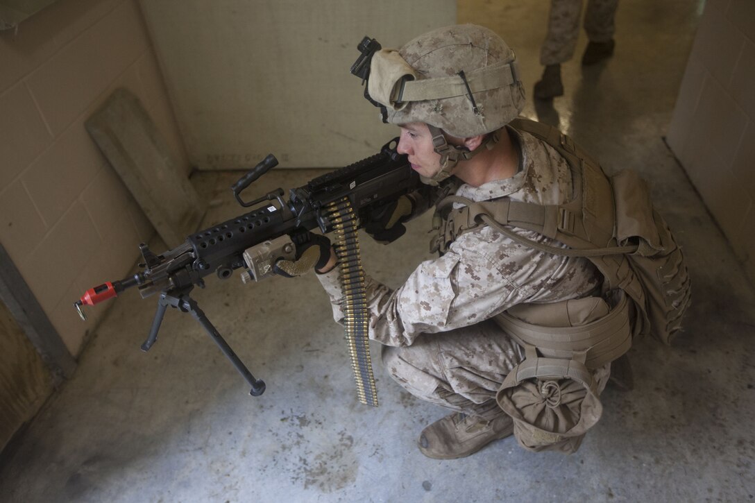 A Marine with India Company, Battalion Landing Team (BLT) 3/2, 26th Marine Expeditionary Unit (MEU), provides cover through a doorway during a simulated raid at Marine Corps Base Camp Lejeune, N.C., Oct. 2, 2012. The company conducted a two-week vertical assault raid package with the Special Operation Training Group in order to help fulfill requirements from the 26th MEU’s mission essential task list. The 26th MEU is slated to deploy in 2013.