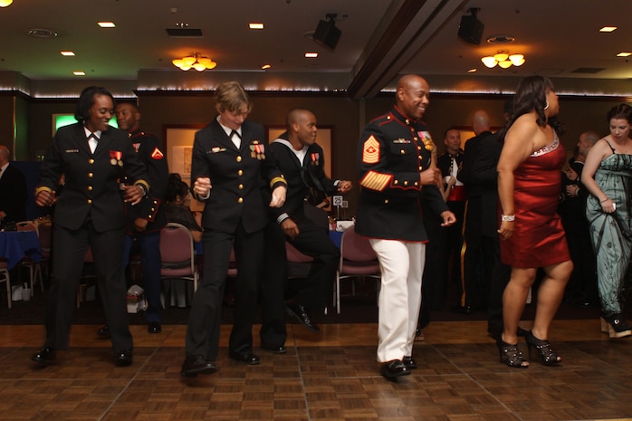 Guests dance the night away at the conclusion of the 237th Navy Ball at the Club Iwakuni Ballroom here Oct. 12, 2012. The guest speaker for the evening was Navy Capt. Moise Willis, Robert M. Casey Medical and Dental Clinic senior medical officer.