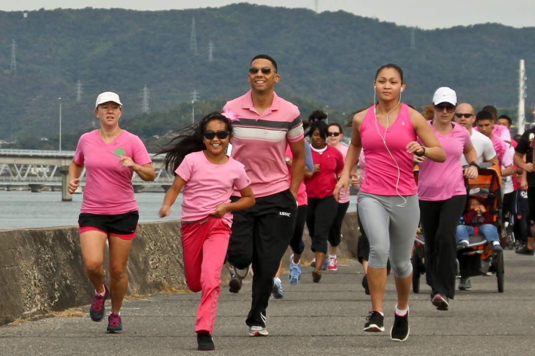 The Race to Save Second Base Five-Kilometer Fun Run participants begin their journey on the seawall here Oct. 12, 2012. 