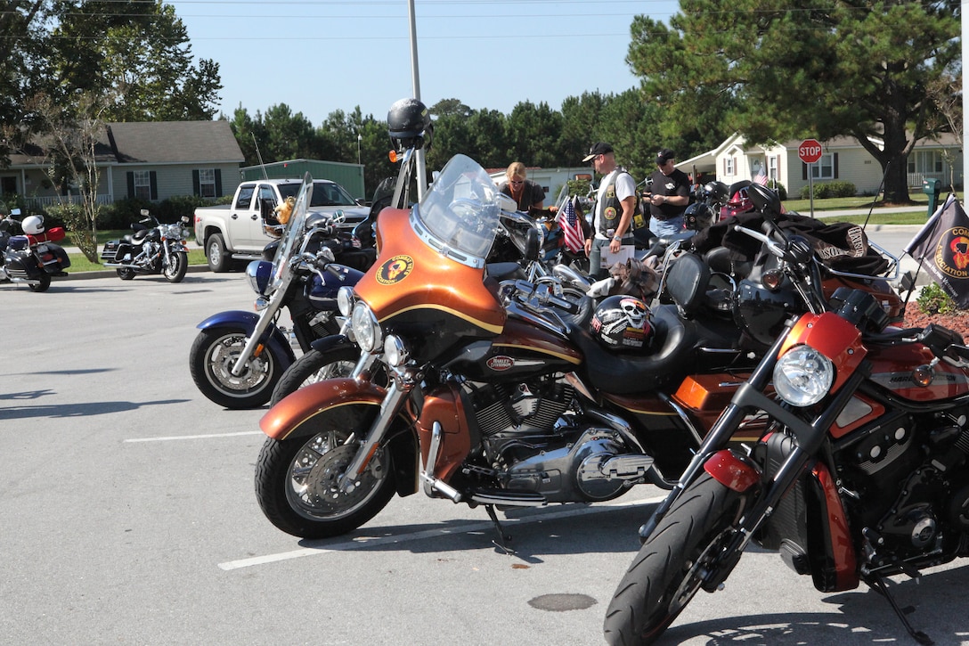 Bikers conversate for a few moments during the Historical Markers Ride alongside their motorcycles Oct. 6 in Jacksonville. The ride benefited the Combat Veterans Motorcycle Association, a group made up of and dedicated to helping combat veterans.