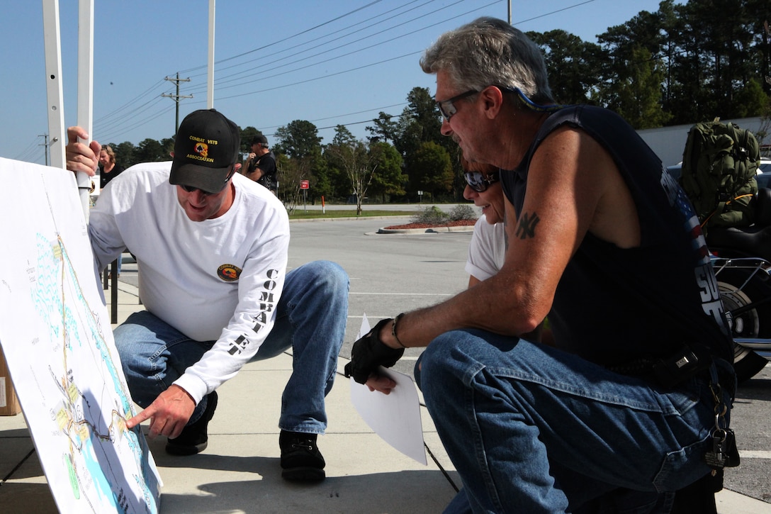 Bikers look over the route they will take during the Historical Markers Ride, an event hosted by the North Carolina Combat Veterans Motorcycle Association Oct. 6 in Jacksonville. The ride was a scavenger hunt where riders answered questions about the areas past. 