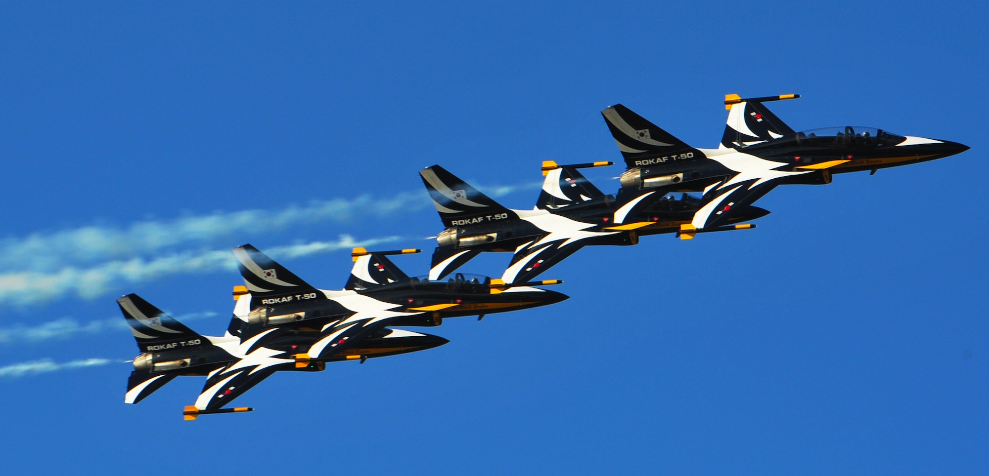 The Black Eagles perform aerial maneuvers over Osan Air Base Oct. 18, 2012, in preparation for Air Power Day Oct. 20-21, 2012. The team can perform up to 30 different types of acrobatics using T-50B training aircraft with supersonic capabilities. (U.S. Air Force photo/Staff Sgt. Stefanie Torres)