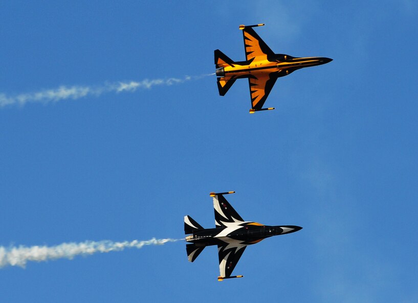The Black Eagles perform aerial maneuvers over Osan Air Base Oct. 18, 2012, in preparation for Air Power Day Oct. 20-21, 2012. The team can perform up to 30 different types of acrobatics using T-50B training aircraft with supersonic capabilities. (U.S. Air Force photo/Staff Sgt. Stefanie Torres)
