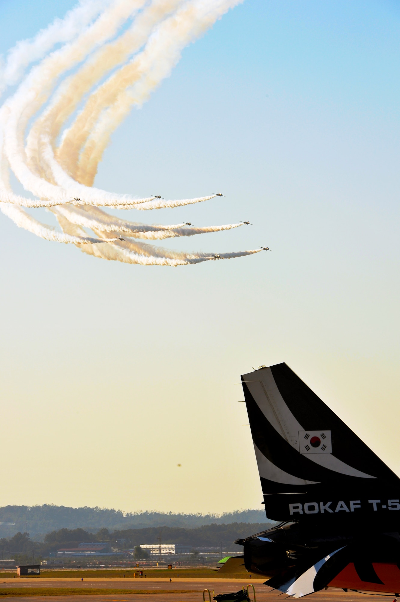 The Black Eagles perform acrobatics over Osan Air Base during a practice Oct. 18, 2012, before Air Power Day Oct. 20-21, 2012. The Black Eagles is the Republic of Korea’s premiere aerial demonstration team and will perform shows to the public Oct. 20-21. (U.S. Air Force photo/Staff Sgt. Stefanie Torres)