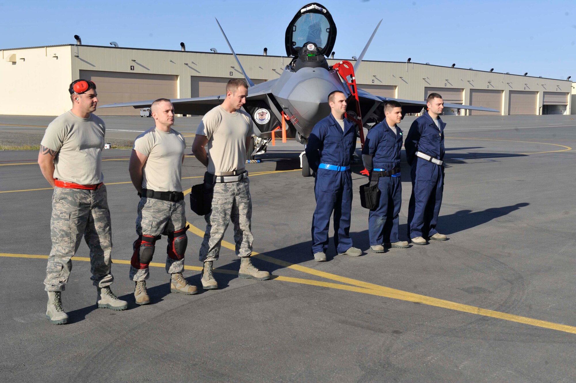 JOINT BASE ELMENDORF-RICHARDSON, Alaska -- 525th and 477th Aircraft Maintenance Squadron members prepare for the annual load competition where two teams test their skills as load crew members for the F-22 Raptor aircraft. The load competition is an annual event held to demonstrate the skill level and knowledge of all Joint Base Elmendorf-Richardson aircraft maintenance including active duty and reserve airmen. (U.S. Air Force photo/ Airman Ty-Rico Lea)
