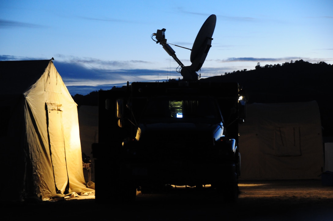 U.S. Army Sgt. 1st Class John Fansler, the communications chief for the 95th Civil Support Team, operates the CST’s Unified Command Suite vehicle to provide the Department of Defense’s Secret Internet Protocol Router Network (SIPRNet) during the 129th Rescue Wing’s Soaring Angel 13-1 at Fort Hunter Liggett, Calif., Oct. 10, 2011. Soaring Angel 13-1 is a collaborative tactical training exercise hosted by the 129th Rescue Wing designed to demonstrate the wing’s rescue and deployable capabilities and interoperability with joint forces. (Air National Guard photo by Staff Sgt. Kim E. Ramirez)

