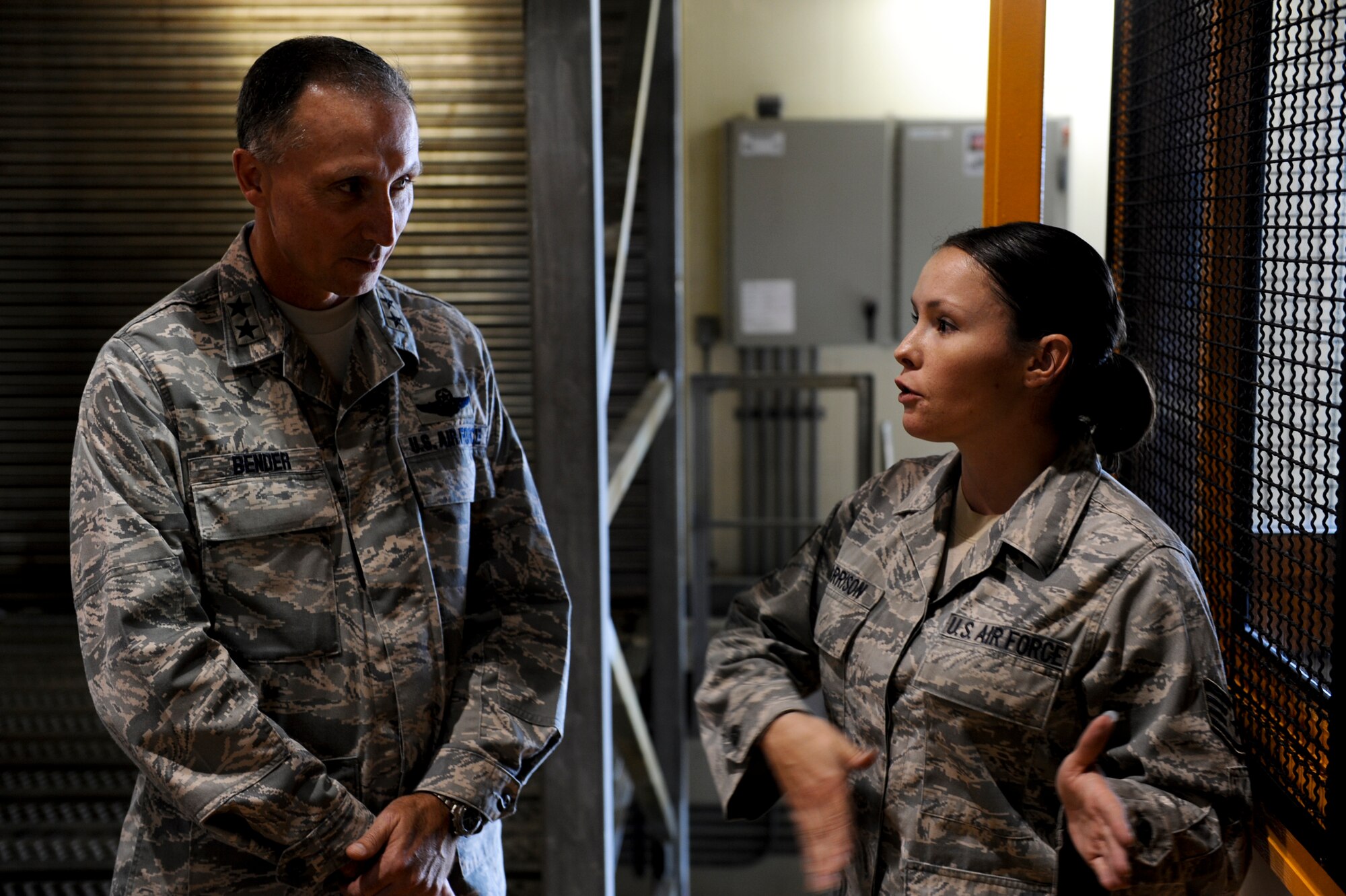 U.S. Air Force Maj. Gen. William J. Bender, U.S. Air Force Expeditionary Center commander, talks with Staff Sgt. Stephanie Harrison, 733rd Air Mobility Squadron air freight supervisor, during a tour of the Air Mobility Command passenger terminal on Kadena Air Base, Japan, Oct. 18, 2012. After recently taking administrative control of the 515th Air Mobility Operations Wing, the general talked to Airmen about how he could help make their jobs easier. (U.S. Air Force photo/Airman 1st Class Justin Veazie)
