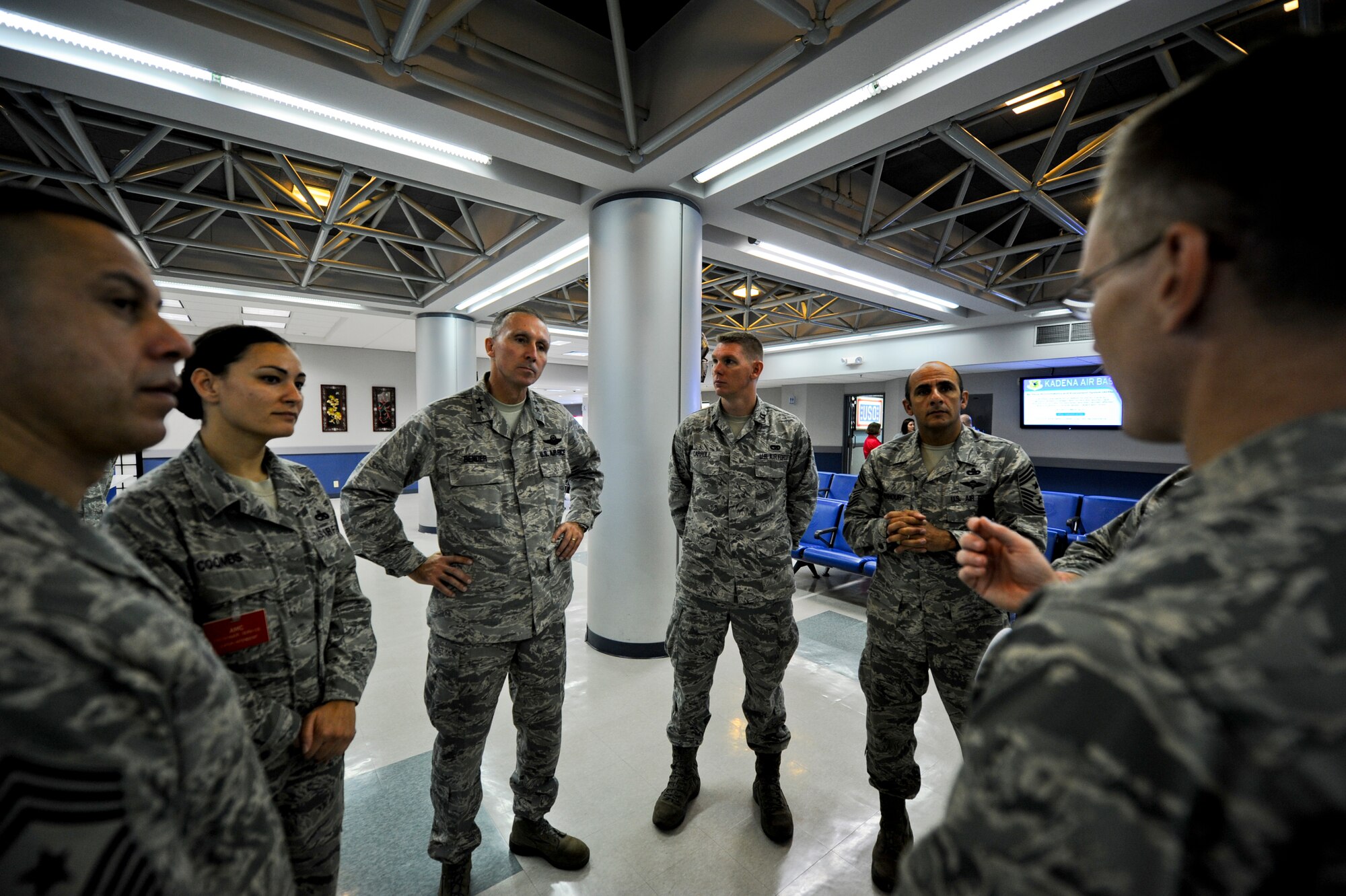U.S. Air Force Lt. Col. Jupe Etheridge, 733rd Air Mobility Squadron commander, briefs (from left to right) Chief Master Sgt. Jeffrey Cui, U.S. Air Force Expeditionary Center command chief, Master Sgt. Jessica Coombs, 733rd Air Mobility Squadron superintendent, Maj. Gen. William J. Bender, U.S. Air Force Expeditionary Center commander, Capt. Jack Carroll, 733rd Air Mobility Squadron aerial port operations officer, and Chief Master Sgt. Samer Alkhoury, 515th Air Mobility Operations Wing command chief, on unique aspects of the Kadena's passenger terminal during a visit to Kadena Air Base, Japan, Oct. 18, 2012. (U.S. Air Force photo/Airman 1st Class Justin Veazie)