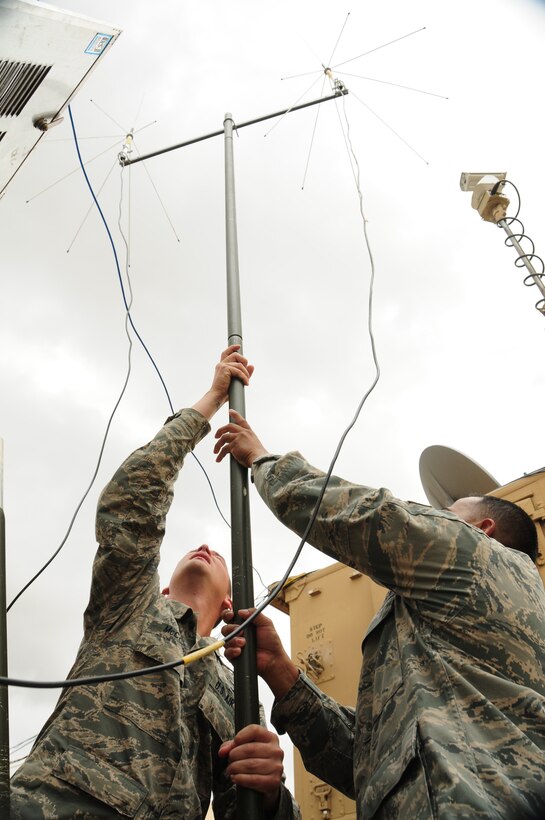 Staff Sgt. Christopher McCook, a telecommunications technician from the IC4U at the California Military Department in Sacramento, Calif., and Senior Airman Deepak Prasad, a radio comunications journeyman from the 129th Communications Flight, sets up an antena during Soaring Angel 13-1 exercise at Fort Hunter Liggett, Calif., Oct. 12, 2012.  Soaring Angel 13-1 is a collaborative tactical training exercise hosted by the 129th Rescue Wing designed to demonstrate the wing’s rescue and deployable capabilities and interoperability with joint forces.
(Air National Guard photos by Staff Sgt. Kim E. Ramirez)

