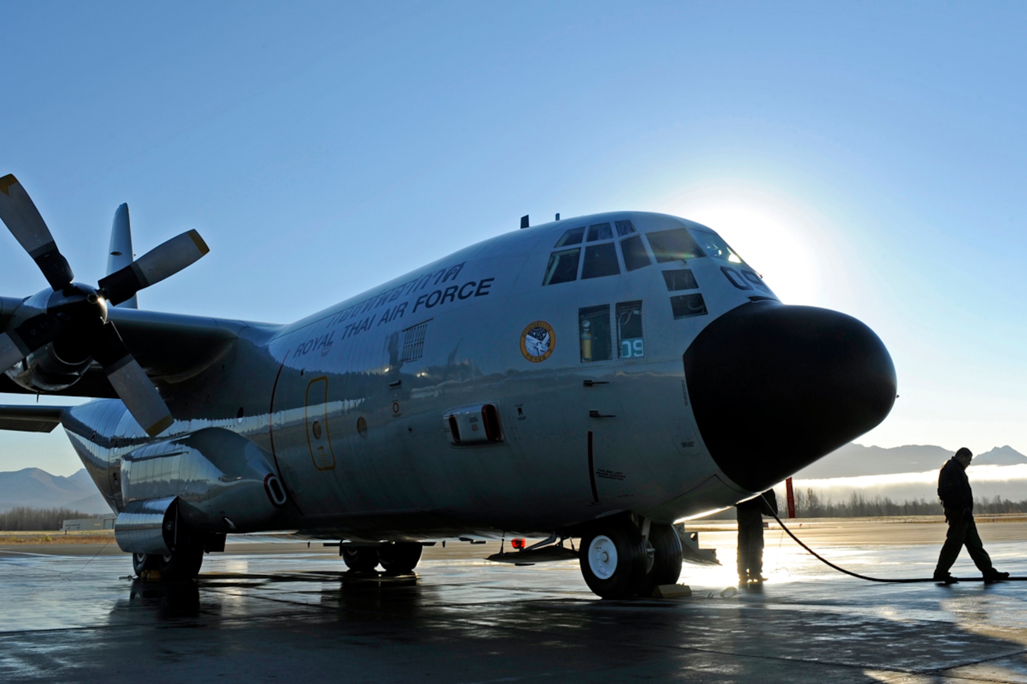 Royal Thai Air Force maintainers look over their C-130 Hercules at Joint Base Elmendorf-Richardson during Red Flag-Alaska, Oct. 12. The C-130 recently had one of its propellers changed due to a leak detected upon arrival at JBER. (U.S. Air Force photo/Tech. Sgt. Brian Ferguson)