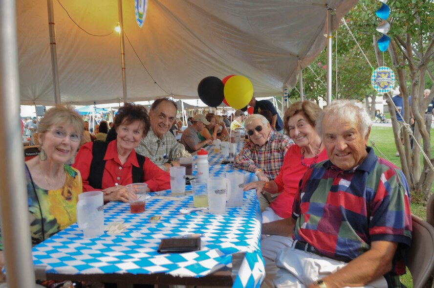 A group of retired veterans, self-proclaimed the "Fun Group", gather for a photo during the 5th annual Oktoberfest celebration on Barksdale Air Force Base, La., Oct. 5. The annual celebration was started in 2007 by retired Col. West Anderson, former 2nd Bomb Wing vice commander and is the base's largest morale event. More than 1400 patrons from Barksdale and the local community attended the event this year. (U.S. Air Force photo/Senior Airman Kristin High)(RELEASED)
