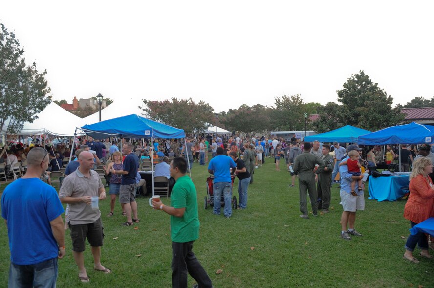 Members of Team Barksdale gather outside the Barksdale Club to celebrate the 5th annual Oktoberfest on Barksdale Air Force Base, La., Oct. 5. The annual celebration was started in 2007 by retired Col. West Anderson, former 2nd Bomb Wing vice commander and is the base's largest morale event. More than 1400 patrons from Barksdale and the local community attended the event this year. (U.S. Air Force photo/Senior Airman Kristin High)(RELEASED)