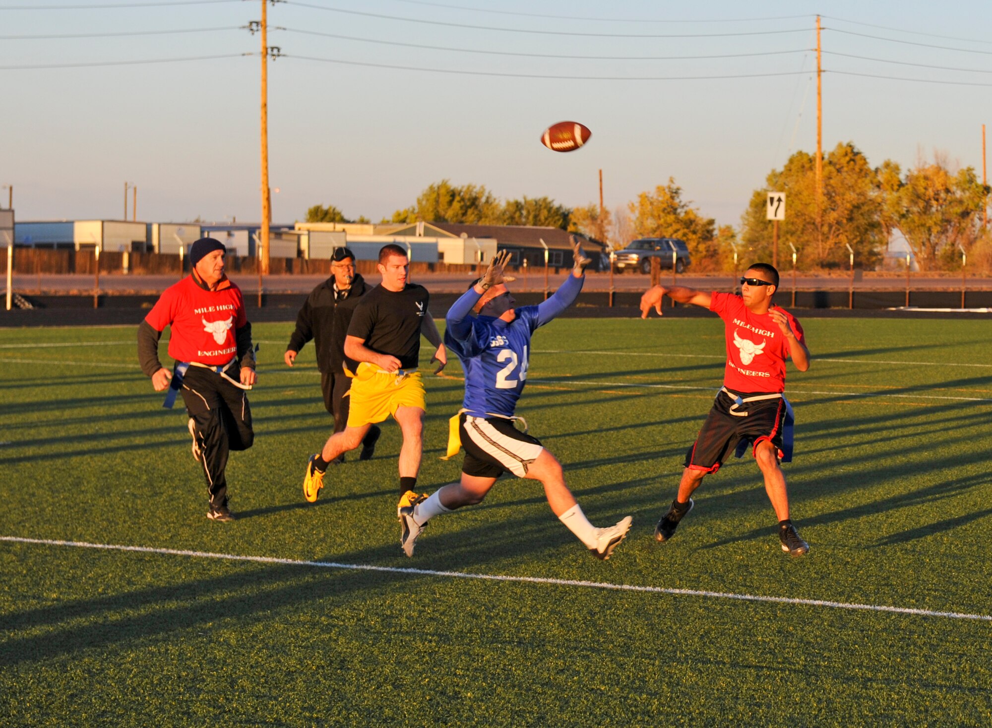 BUCKLEY AIR FORCE BASE, Colo. – Carlos Gomez, 460th Civil Engineer Squadron, throws a pass against the 566th Intelligence Squadron during an intramural football game Oct. 17. 566 IS won the game with a score of 27-6 improving their record to 7-4 while CES fell to 2-6. Gomez completed eight of his 19 pass attempts for 121 yards, a touchdown and an interception. (U.S. Air Force photo by Senior Airman Christopher Gross)