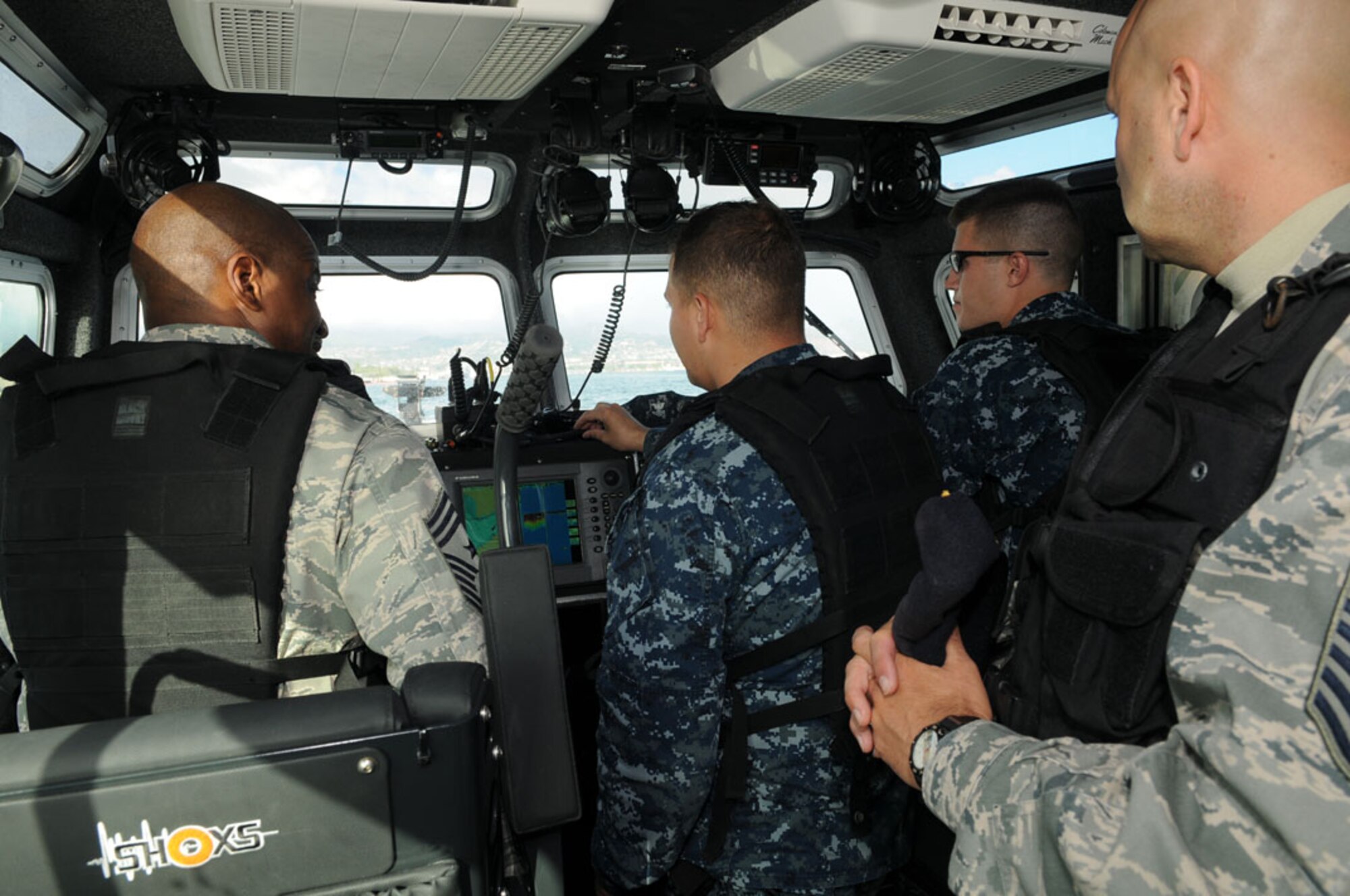 Chief Master Sgt. Jerry Moore, 11th Air Force command chief from Joint Base Elmendorf-Richardson, Alaska, rides with Harbor Patrol Oct. 16 at the Binnicker Professional Military Education center on Joint Base Pearl Harbor-Hickam, Hawaii.  (U.S. Navy photo by David D. Underwood, Jr.)