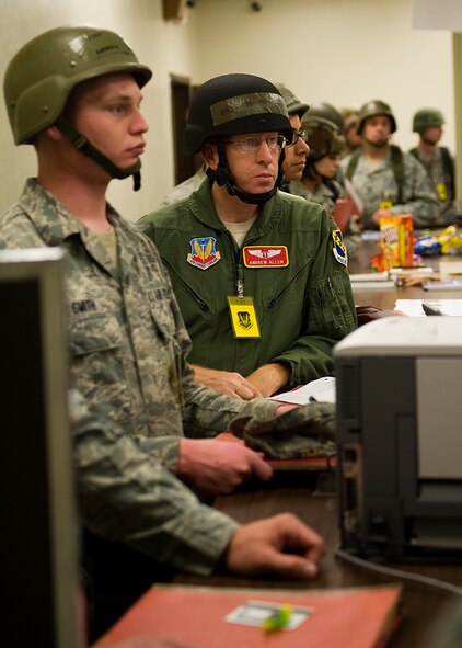 Airmen process through a predeployment fitness line Oct. 16, 2012, during an Operational Readiness Exercise at Dyess Air Force Base, Texas. For three days Team Dyess was tested on their ability to deploy personnel and assets to a deployed location in support of combatant commanders during an ORE Oct. 15-17. During this exercise, known as a Phase I ORE, Dyess was evaluated on the wing’s ability to prepare and mobilize from peacetime readiness to a wartime posture on short notice. Areas evaluated included command and control, deployment processing, employment readiness, information operations and force protection. (U.S. Air Force photo by Airman 1st Class Damon Kasberg/ Released)