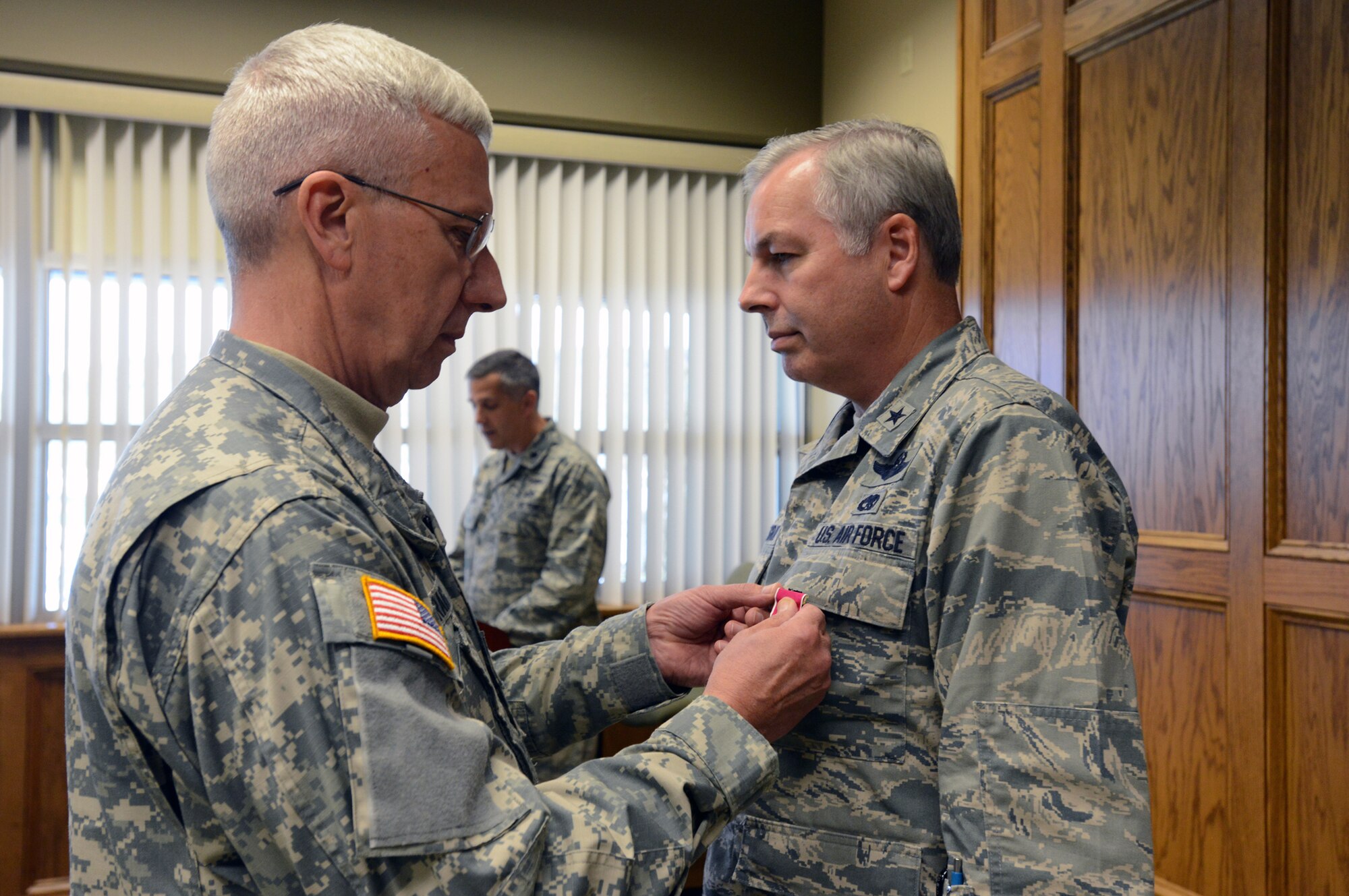 FORT INDIANTOWN GAP, Pa. -- Maj. Gen. Wesley Craig, Pennsylvania adjutant general, awarded Brig. Gen. Roy E. Uptegraff III, the Legion of Merit during a ceremony at the installation Oct. 12, 2012. Brig. Gen. Uptegraff is the former commander of the Pennsylvania Air National Guard's 171st Air Refueling Wing. He was awarded the award for his exemplary leadership of the 171st, his exemplary efforts commanding the 313th Air Expeditionary Wing during Operations ODYSSEY DAWN and UNIFIED PROTECTOR, and his work as chairman of the National Guard's Air Directorate Field Advisory Council and KC-135 Weapons System Council. Brig. Gen. Uptegraff currently serves as the Air National Guard Assistant to the Commander, Air Mobility Command. (Pennsylvania National Guard photo by Staff Sgt. Ted Nichols/Released)