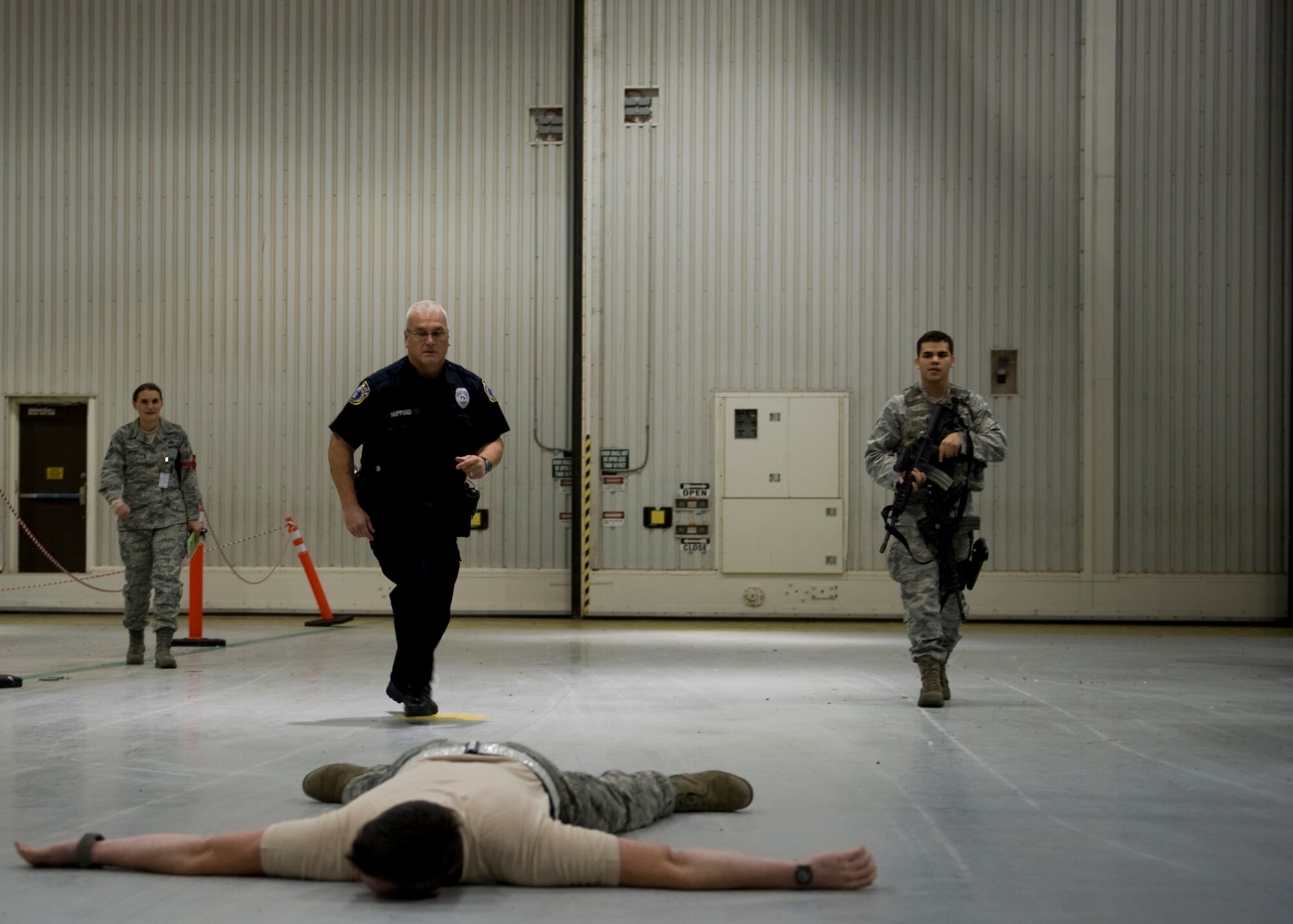 Members of the 7th Security Forces Squadron apprehend an “intruder” Oct. 15, 2012, during an Operational Readiness Exercise at Dyess Air Force Base, Texas. For three days Team Dyess was tested on their ability to deploy personnel and assets to a deployed location in support of combatant commanders during an ORE Oct. 15-17. During this exercise, known as a Phase I ORE, Dyess was evaluated on the wing’s ability to prepare and mobilize from peacetime readiness to a wartime posture on short notice. Areas evaluated included command and control, deployment processing, employment readiness, information operations and force protection. (U.S. Air Force photo by Airman 1st Class Damon Kasberg/ Released)