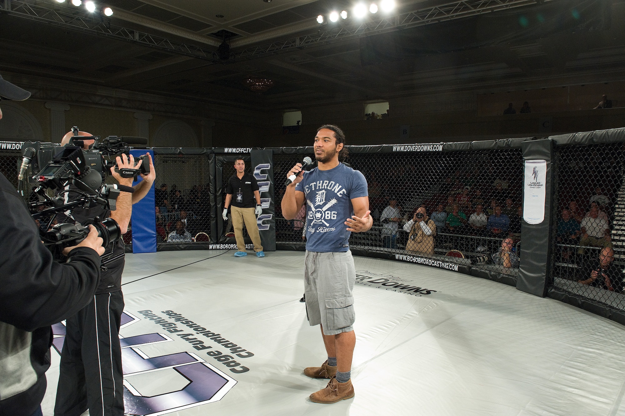 Ben Henderson, the current Ultimate Fighting Championship lightweight champ, thanks the Air Force Reserve for the opportunity to come to Dover, Del., as part of the 512th Airlift Wing's Mass Enlistment Ceremony, held at a mixed martial arts event Oct. 13, 2012. Henderson is one of many UFC fighters featured at Air Force Reserve recruiting events around the world. (U.S. Air Force photo/Roland Balik)