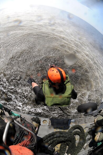 U.S. Air Force Staff Sgt. Alejandro Cerrano, 38th Rescue Squadron pararescueman, freefalls from an HH-60G Pave Hawk into the Gulf of Mexico during water operations training, Oct. 11, 2012. The training allowed Cerrano and Pave Hawk aircrew from the 41st Rescue Squadron to practice various entry and exit methods for water rescue situations. (U.S. Air Force photo by Staff Sgt. Joshua J. Garcia/Released)  