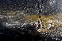 U.S. Air Force Staff Sgt. Justin Tyler, 38th Rescue Squadron pararescueman, climbs a rope ladder during water operations training in the Gulf of Mexico, Oct. 11, 2012. Tyler trained on various methods to enter and leave the water during the training. (U.S. Air Force photo by Staff Sgt. Joshua J. Garcia/Released)  