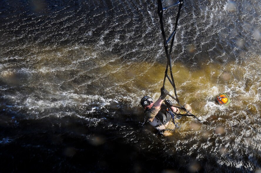 U.S. Air Force Staff Sgt. Justin Tyler, 38th Rescue Squadron pararescueman, climbs a rope ladder during water operations training in the Gulf of Mexico, Oct. 11, 2012. Tyler trained on various methods to enter and leave the water during the training. (U.S. Air Force photo by Staff Sgt. Joshua J. Garcia/Released)  