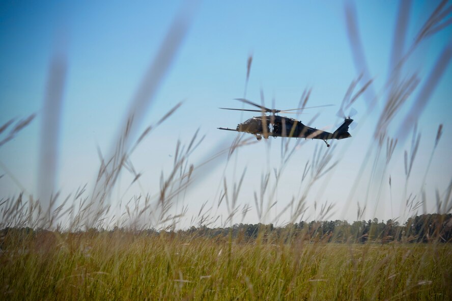 An HH-60G Pave Hawk from the 41st Rescue Squadron circles around to pick up personnel during training near Moody Air Force Base, Oct. 11, 2012. Pilots practiced inbound flight tactics when approaching downed personnel. (U.S. Air Force photo by Staff Sgt. Joshua J. Garcia/Released)  