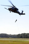 U.S. Air Force Staff Sgt. Justin Tyler, 38th Rescue Squadron pararescueman, rappels from an HH-60G Pave Hawk from the 41st Rescue Squadron during operations training near Moody Air Force Base, Ga., Oct. 11, 2012. Tyler practiced various maneuvers to descend from the aircraft during the training. (U.S. Air Force photo by Staff Sgt. Joshua J. Garcia/Released)  
