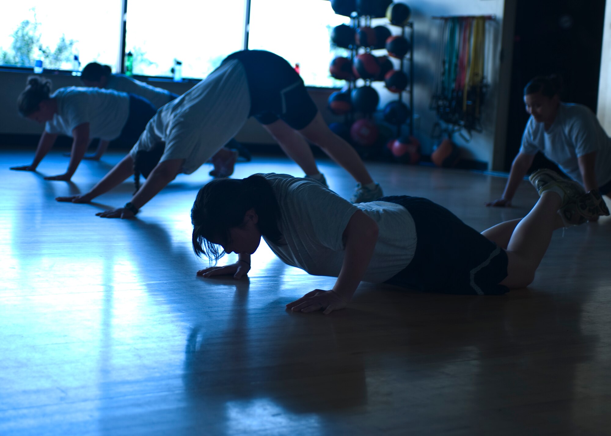 Airmen participating in Hurlburt Field’s post-pregnancy physical training class warm up before a rigorous work out at the Riptide Fitness Cener at Hurlburt Field, Fla., Oct. 17, 2012.  More than 20 female Airmen come together three times a week for high-intensity strength and cardio workouts. (U.S. Air Force Photo/Airman 1st Class Hayden K. Hyatt)