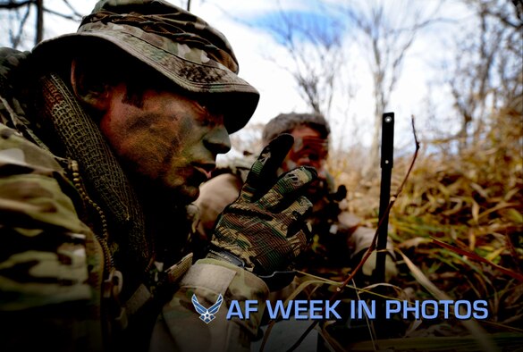 Tech. Sgt. Bobby Colliton instructs Staff Sgt. Dane Hatley at combat survival training during 2012 Pacific Thunder near Osan Air Base, South Korea, Oct. 15, 2012. Colliton is a survival evasion resistance and escape specialist from the 18th Operation Support Squadron at Kadena Air Base, Japan, and Hatley is a 33rd Rescue Squadron flight engineer. (U.S. Air Force photo/Staff Sgt. Sara Csurilla)

