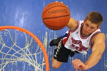 Airman 1st Class Derek VanHorn, 319th Air Base Wing Public Affairs, attempts a shot Oct. 18, 2012, at the fitness center on Grand Forks Air Force Base, N.D. VanHorn works as a military journalist and said the best part of his job is having the opportunity to interview and interact with many different people from many different career fields. (U.S. Air Force photo/Tech. Sgt. Johnny Saldivar)
